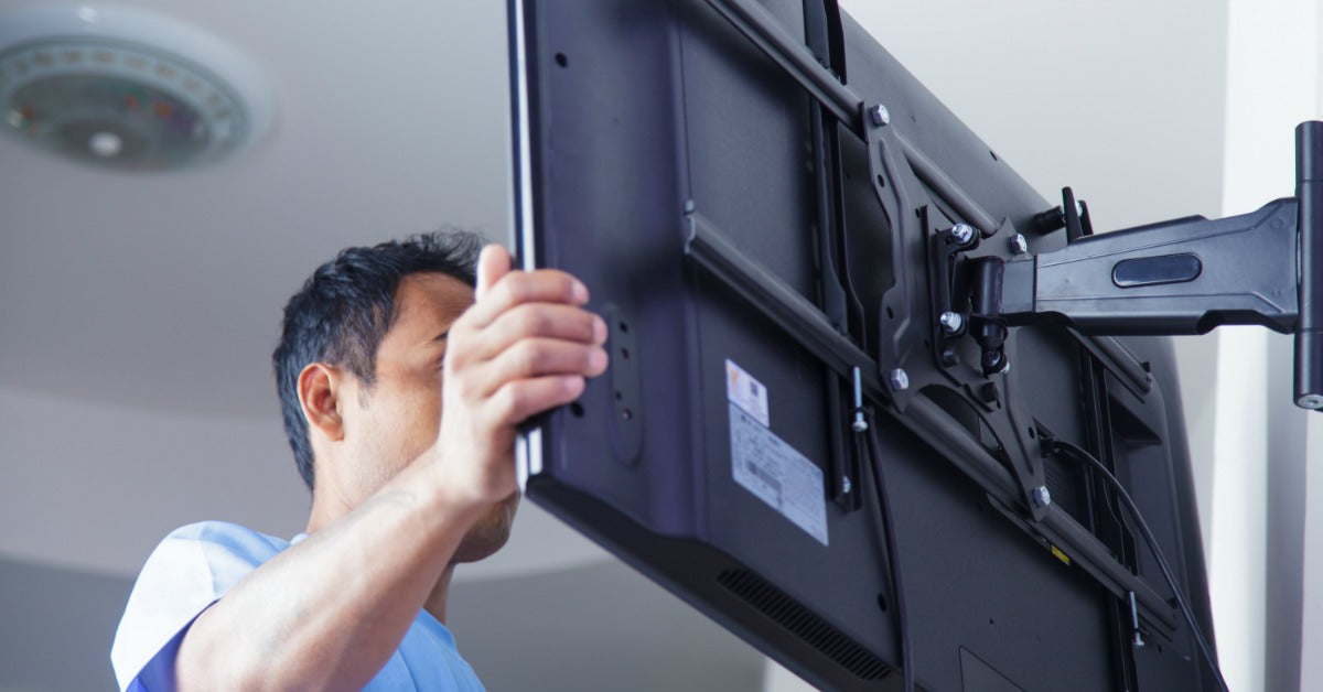 Man Installing Flat Screen Television