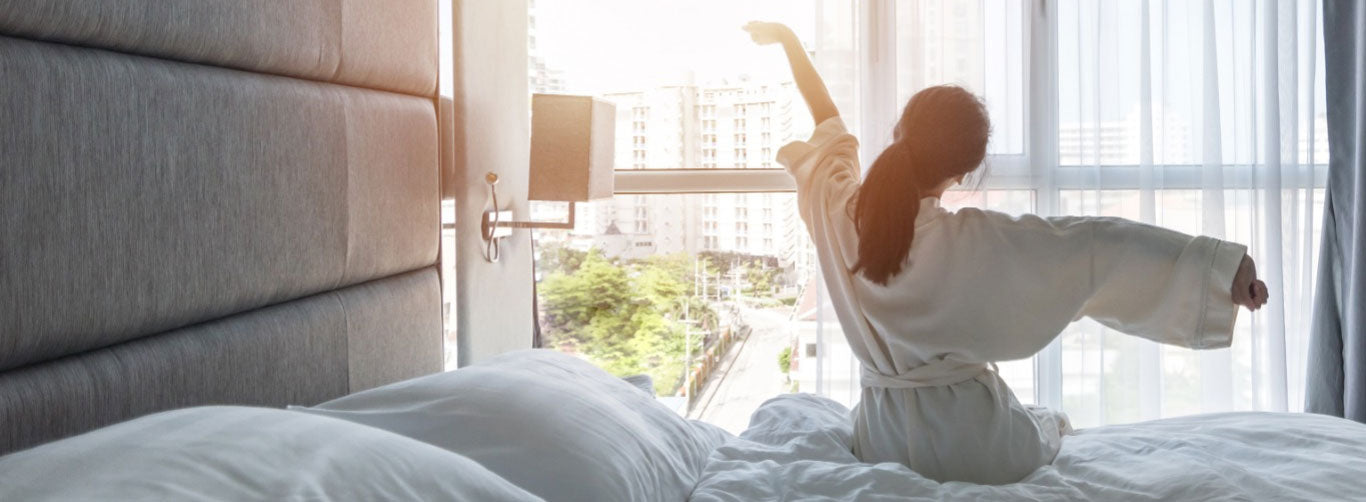 Hotel Guest Waking up to Climate Controlled Environment